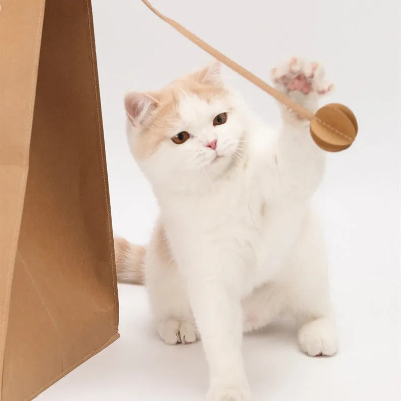 Brown cat nest paper bag with integrated scratch board and cardboard tunnel, dimensions 40cm by 30cm by 53cm.