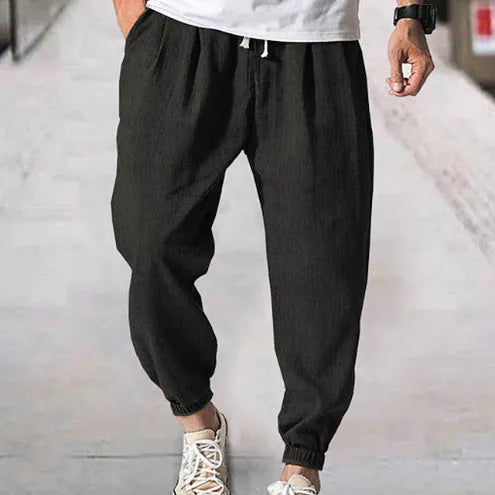 Men's loose-fit cotton trousers with elastic ankle cuffs in multiple colour options