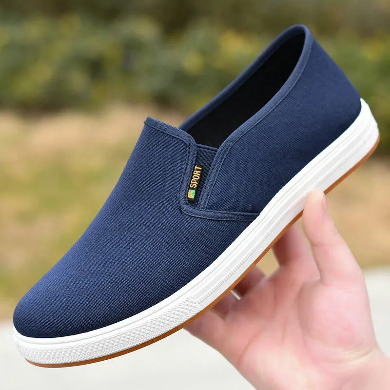 Men's black canvas slip-on shoes with round toe and low-top design