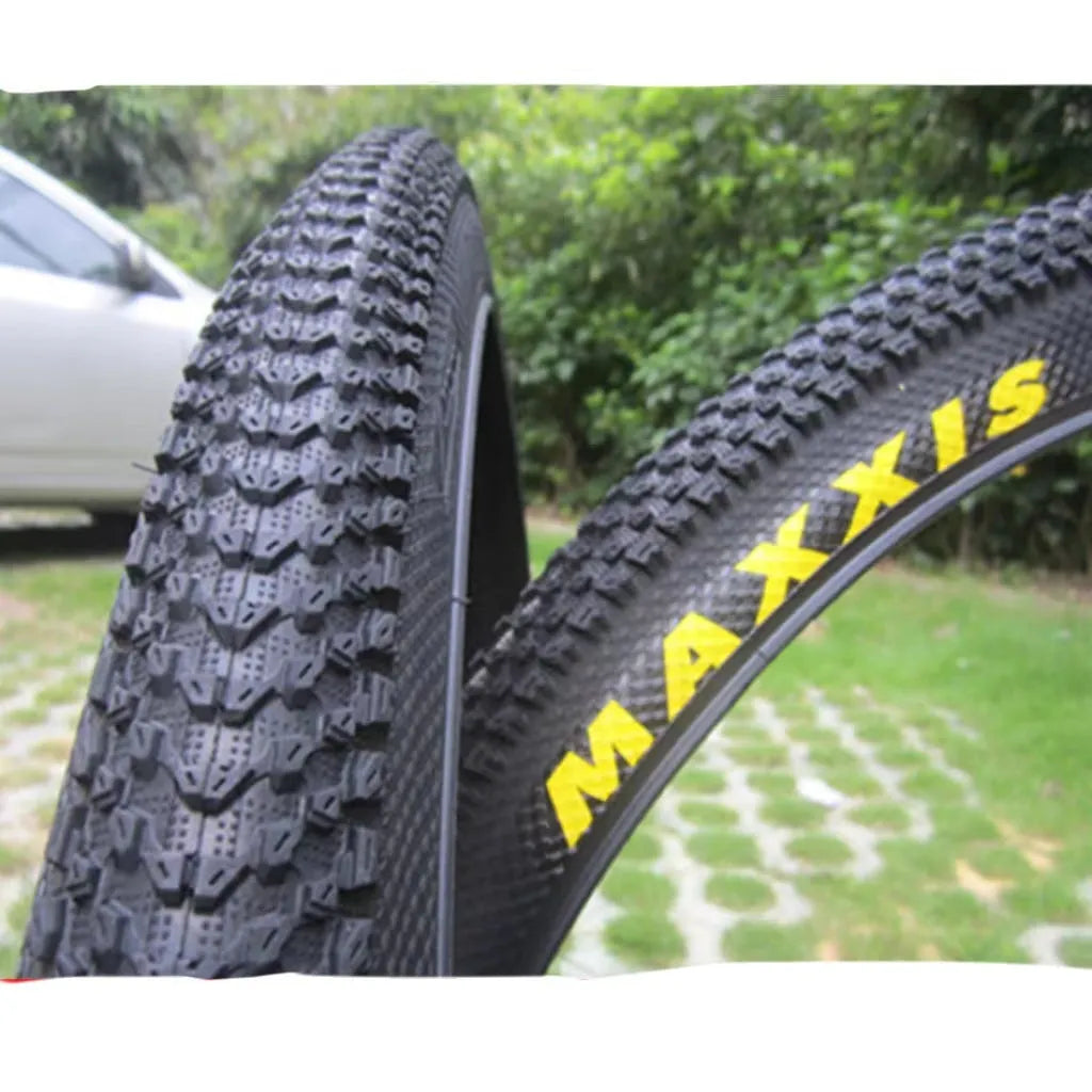 Ultralight puncture-proof mountain bike tyre shown in black with aggressive tread pattern.