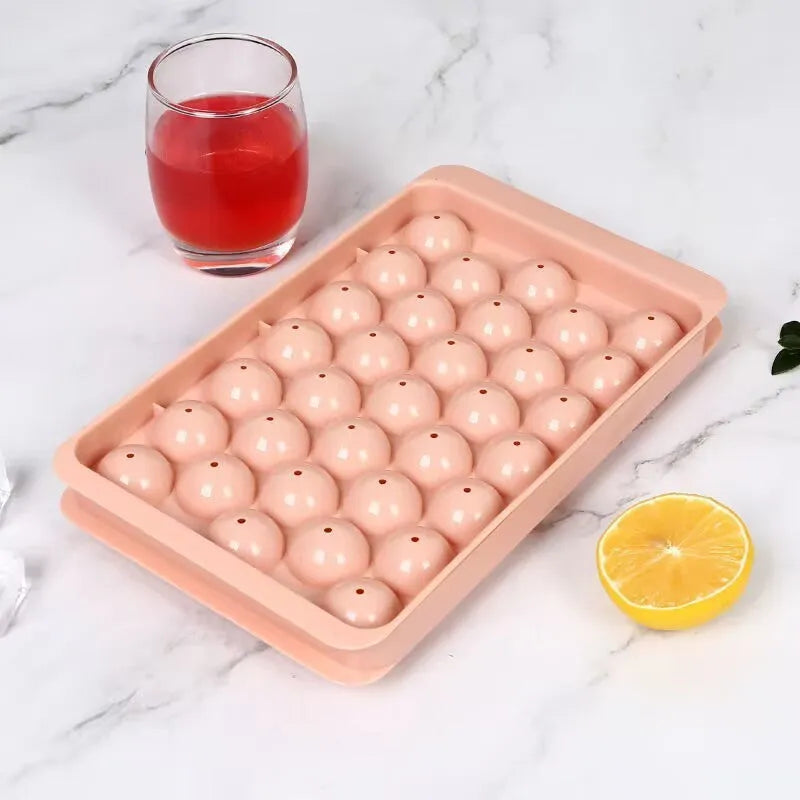 Blue silicone ice cube tray with lid showing 33 round grids for homemade ice making
