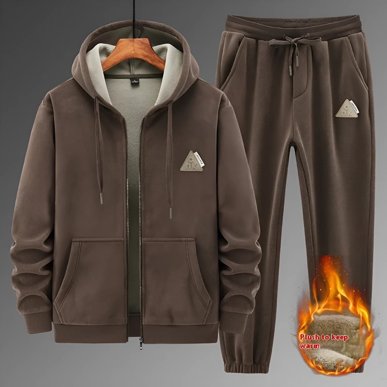 Casual grey sports suit set with a hooded cashmere-feel sweater and matching cotton-look pants on a hanger.