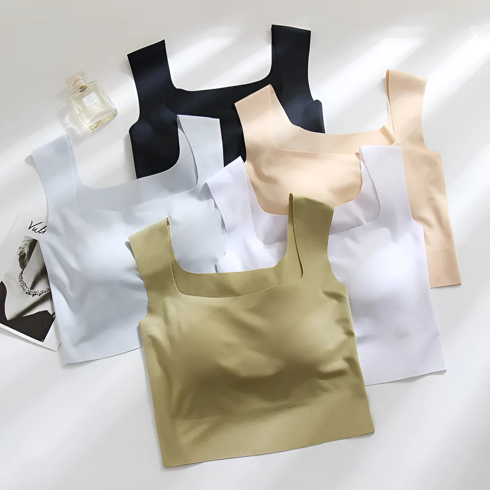 Women's non-marking nylon sling vest with chest pad in light blue, showing seamless beauty back design.