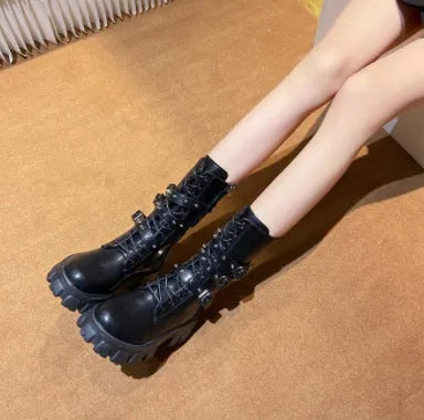 Women's black mid-calf knight boots with side zipper and metal belt buckle on artificial PU upper.