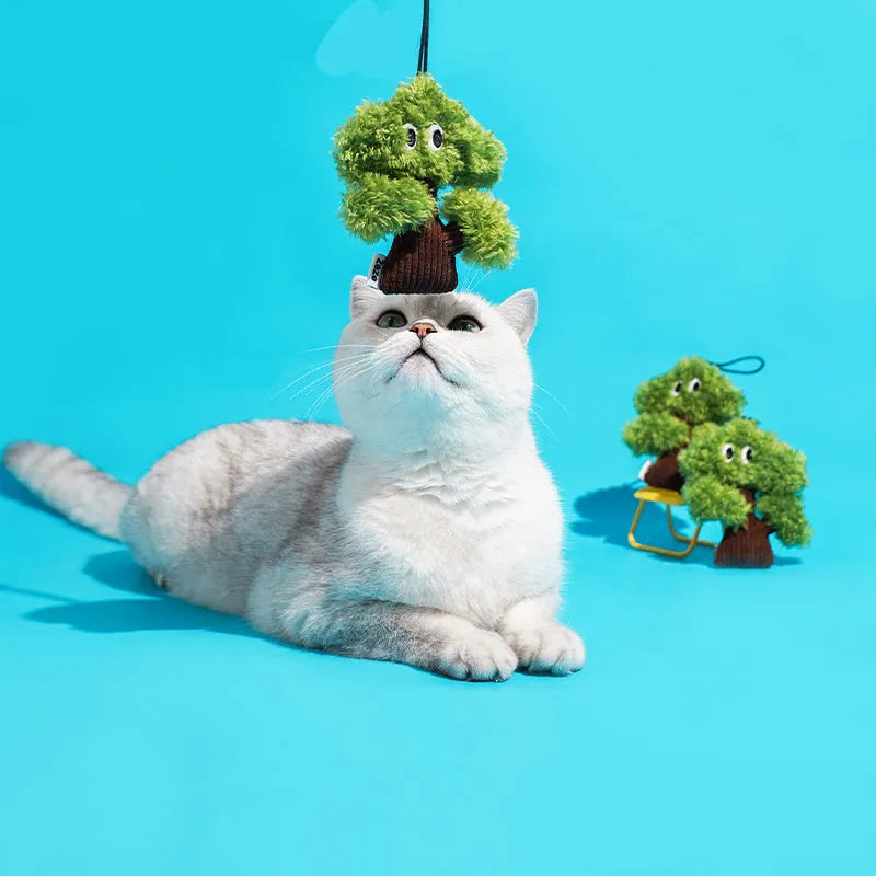 Plush pine tree-shaped cat toy with mint filling, shown in three available sizes for feline biting and grinding play.