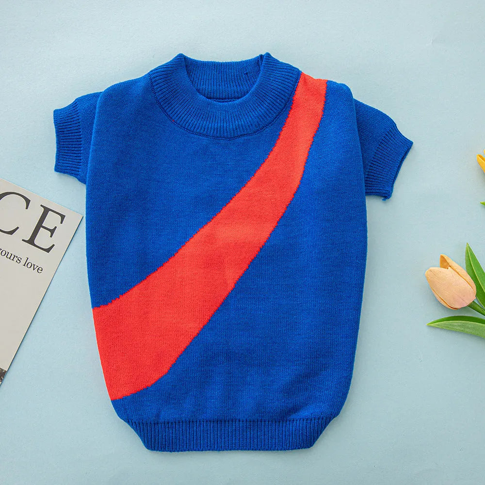 Wool knit dog sweater for corgis and poodles in assorted colours and sizes on a mannequin.