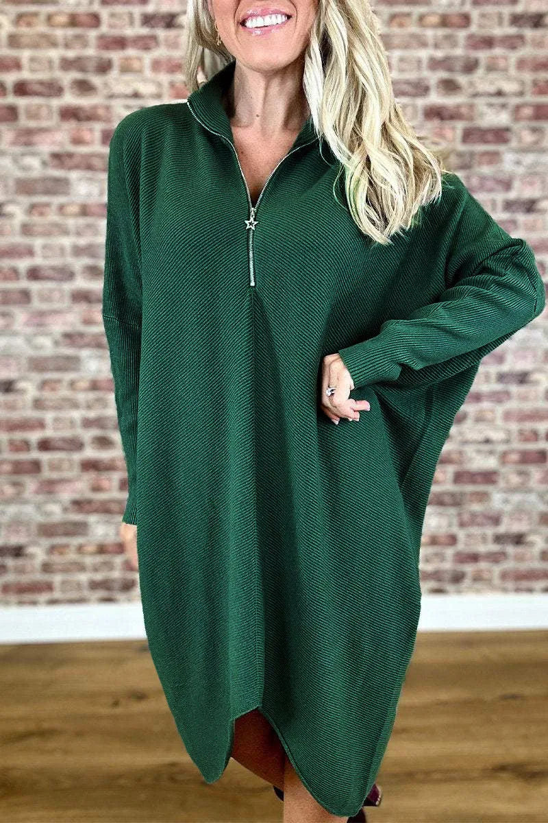 Women's solid colour loose fit knit dress with raglan sleeves on a hanger.