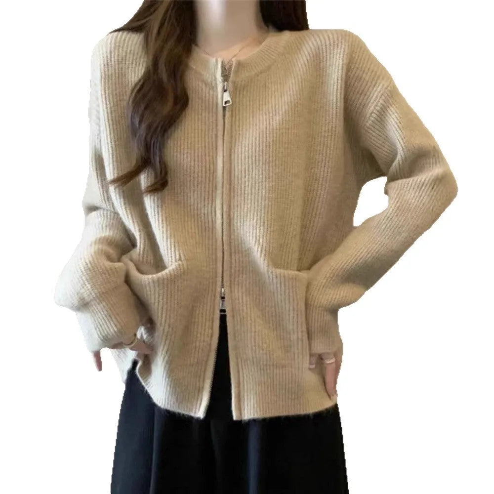 Beige viscose knit cardigan coat with long sleeves on a hanger.