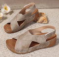 Women's brown platform Roman sandals with skirted ankle strap and Velcro fastening on a white background.