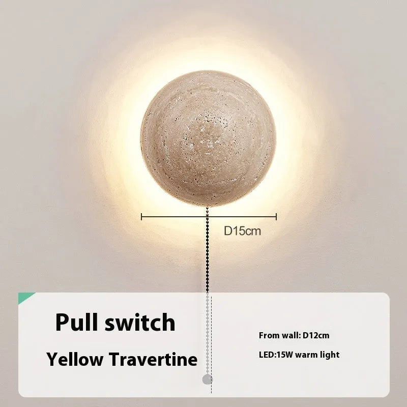 Vintage semicircle wall lamp with yellow cave stone shade and black iron frame mounted on a wall.