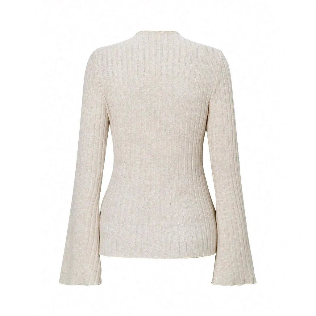 Black slim fit long sleeve top with round neck and lantern sleeves on a mannequin.