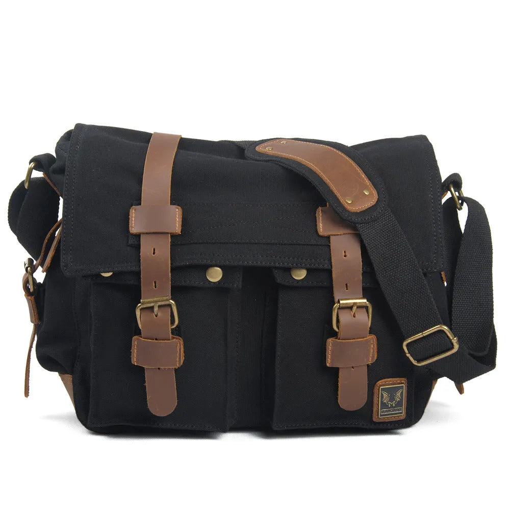 Men's brown retro canvas crossbody shoulder bag with cowhide trim, shown with flap open revealing internal zip pockets.