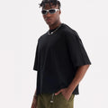 Man wearing a loose fit apricot coloured pure cotton t-shirt, short sleeves, casual American style.