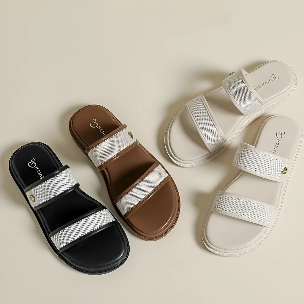Women's brown retro soft bottom flip-flops with an artificial PU upper on a plain background.