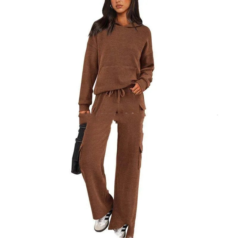 Women's two-piece polyester leisure suit in a solid colour, showing long sleeves and full-length trousers.