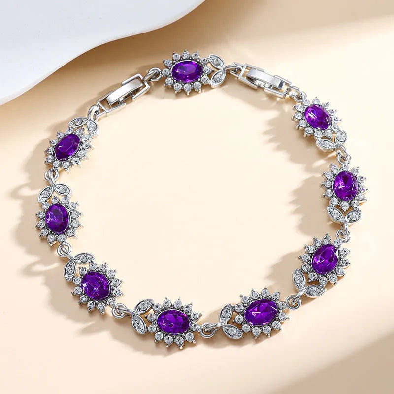 Women's bracelet with inlaid zircon gemstones in multiple colours on environmentally friendly alloy band