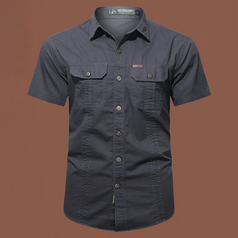 Men's army green cotton work shirt with short sleeves and a loose, non-iron fit.