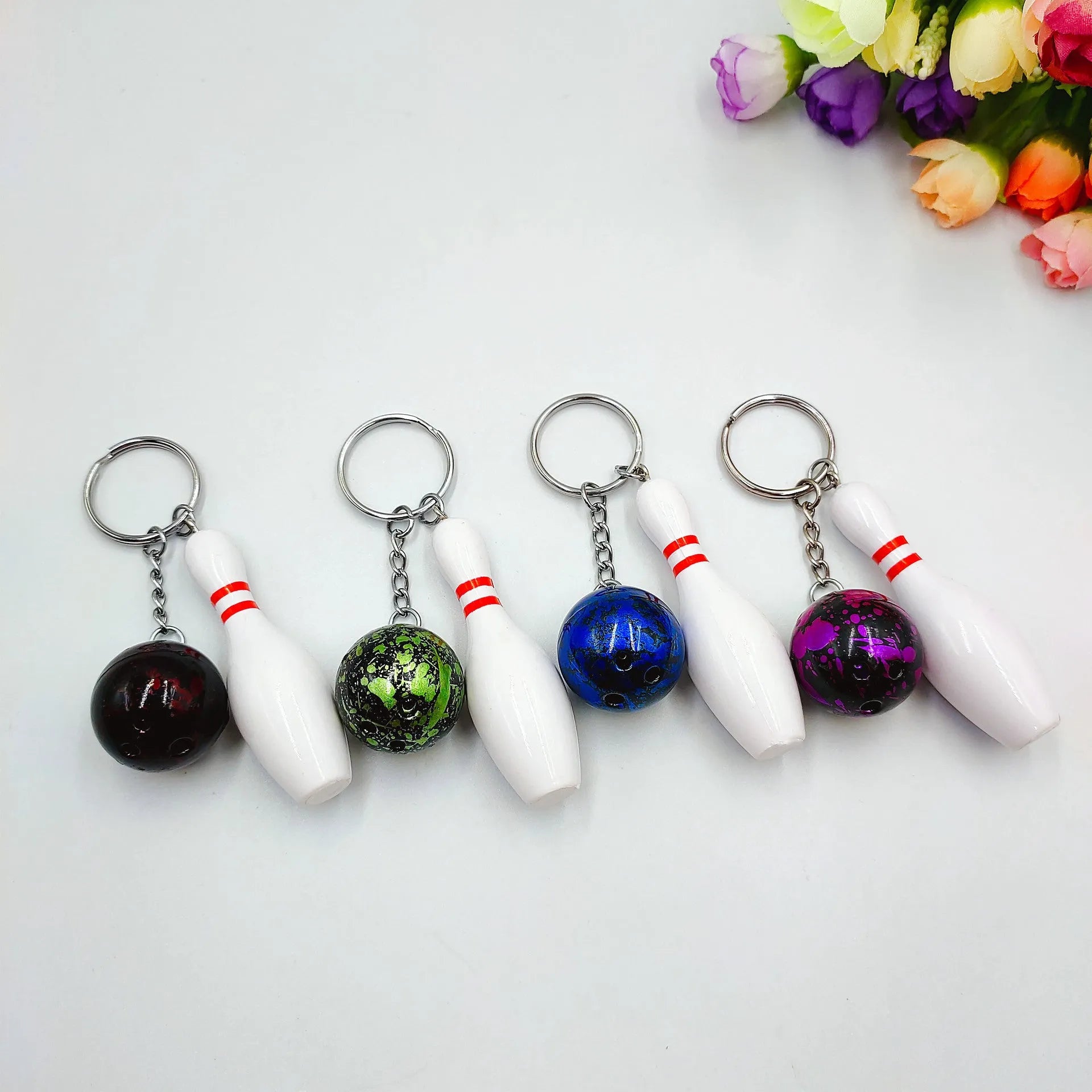 Mini simulation sports bowling keychain pendant in PVC metal on a key ring.