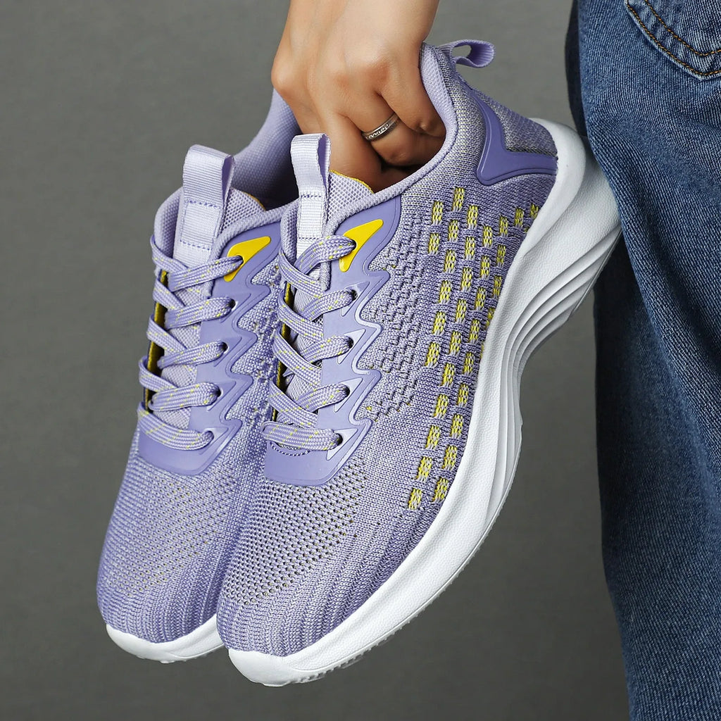 Women's lavender purple Flyknit running shoes with striped pattern and mesh design for sports