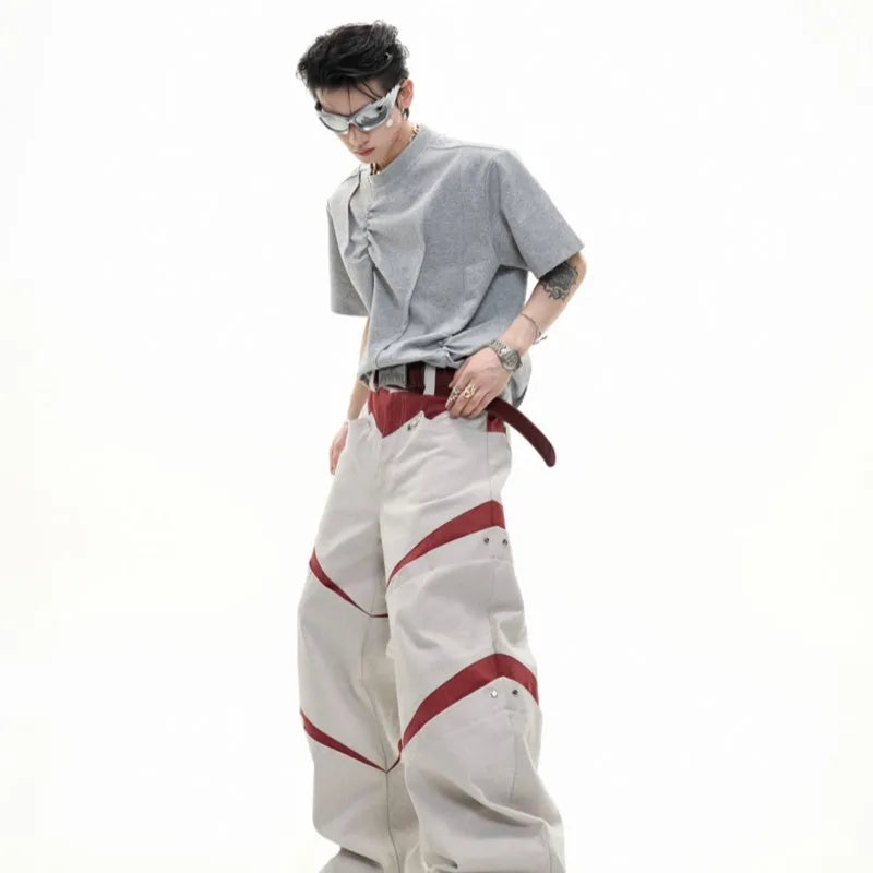 Men's grey cotton T-shirt with loose fit, round neck, short sleeves, and textured three-dimensional pleats.