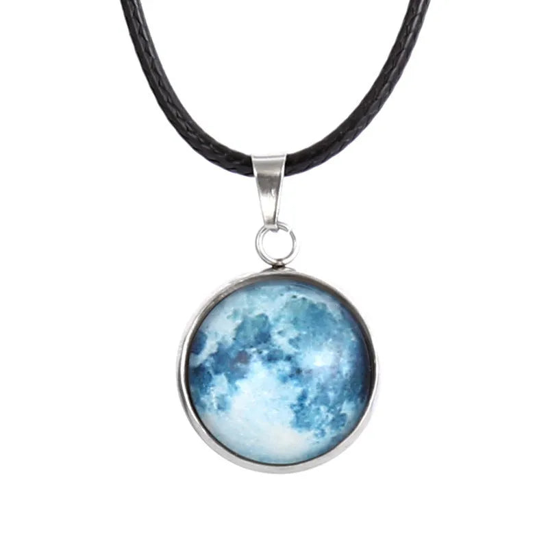 Luminous alloy and organic glass constellation pendant necklace with adjustable chain on white background.