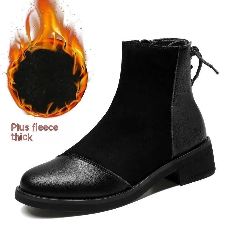 Black women's knee-high Martin boots with a bow detail and side zip on a rubber sole.