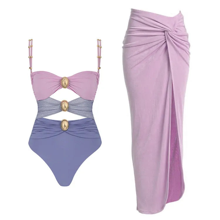 Women's solid colour one-piece swimsuit with gold buttons and a matching skirt in assorted colours