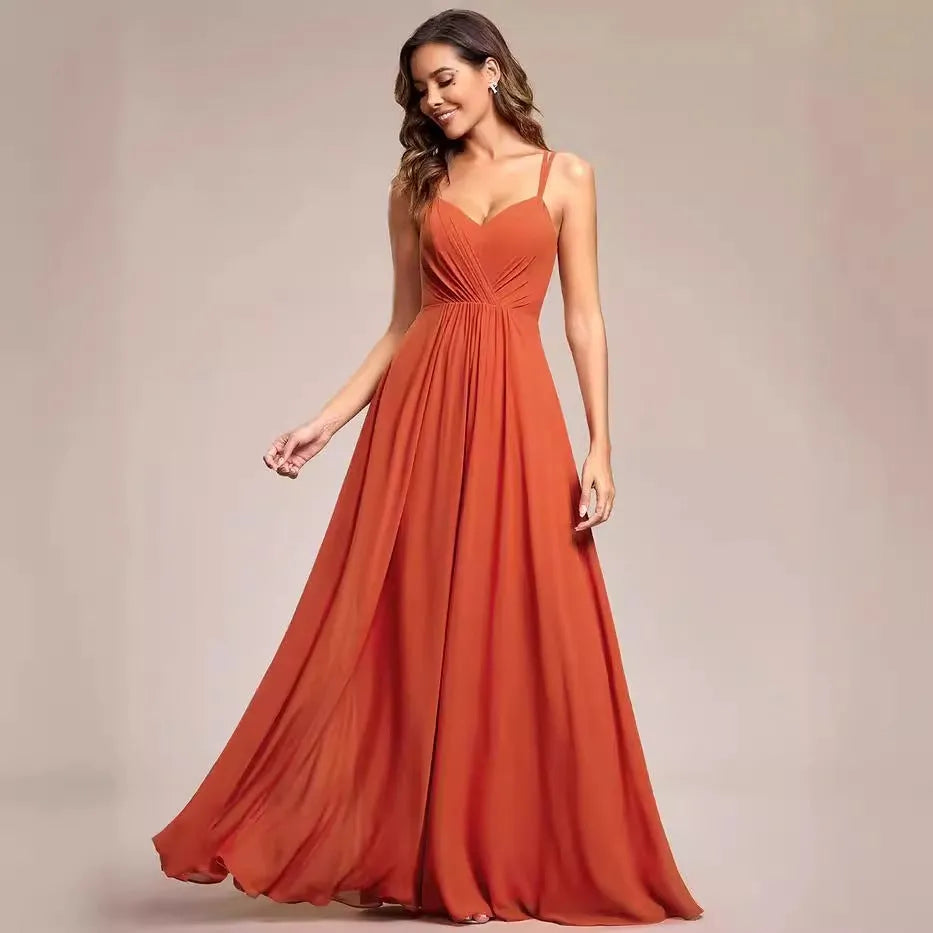 Women's sleeveless pleated A-line long dress in light green, shown in a solid colour with a long skirt.