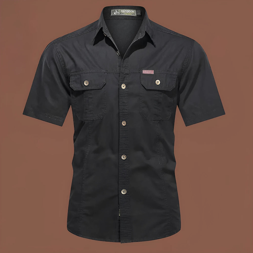Men's army green cotton work shirt with short sleeves and a loose, non-iron fit.