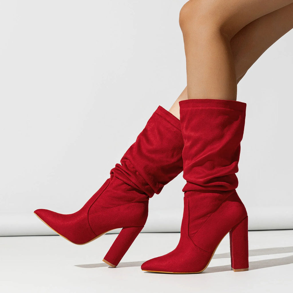 Women's black suede chunky heel pointed-toe mid-calf boots on a white background.