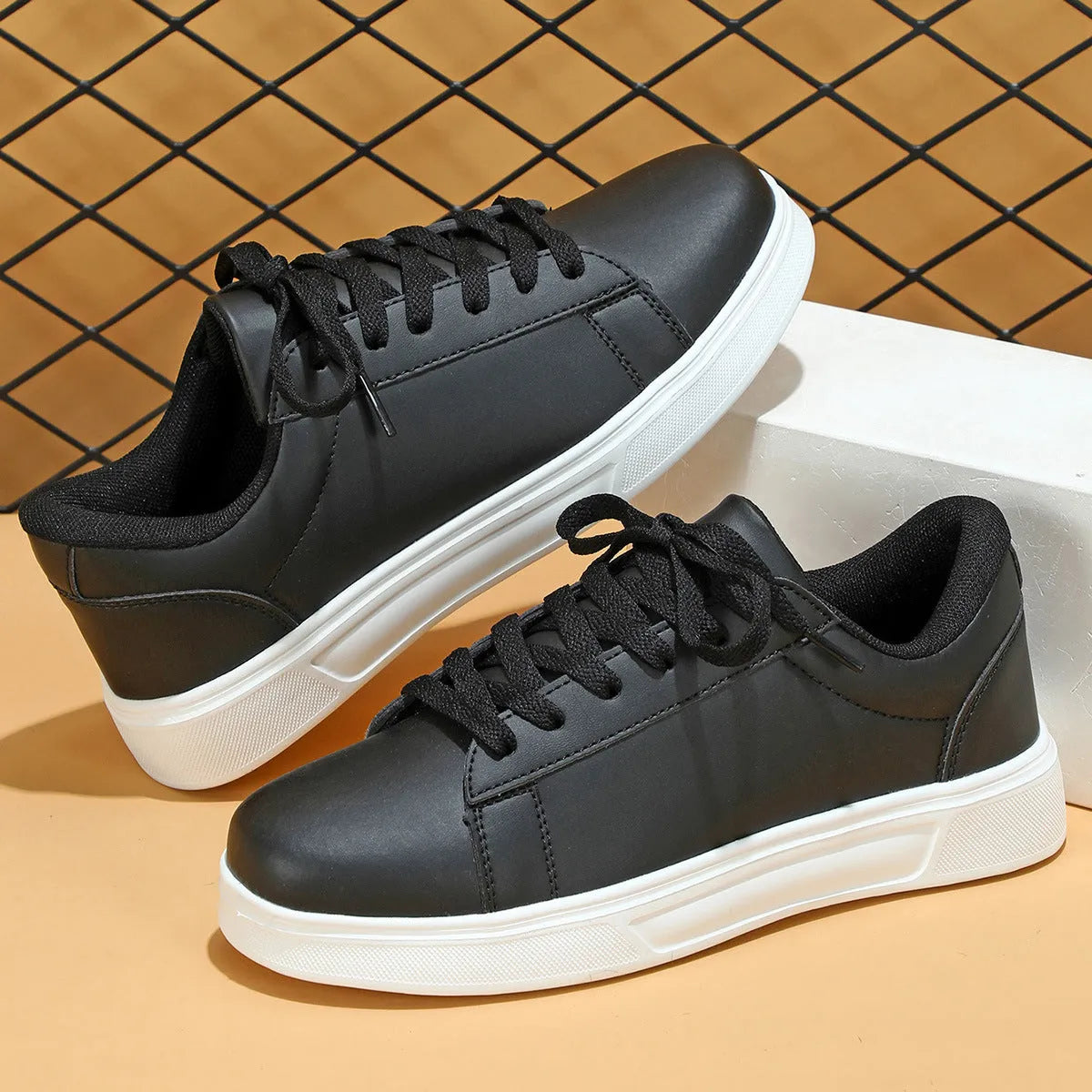 Beige brown platform skateboard sneaker with low top, round toe, and cross-belt design on a white background.