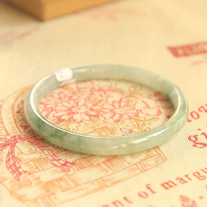 Green geometric jade waxy bracelet with manual craftsmanship and Chinese style design