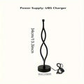 Black aluminium USB desk lamp with three-colour button dimming on a desktop surface