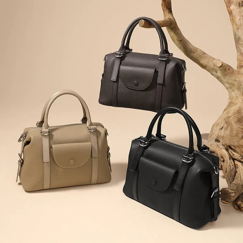 Genuine leather street trend ladies handbag with single shoulder strap in black, brown, or elephant grey.