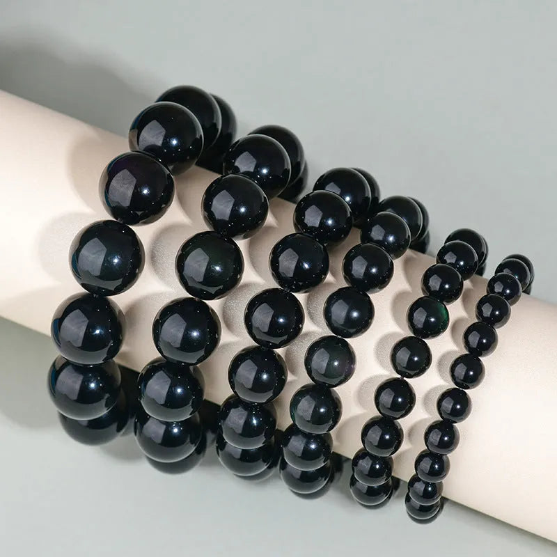 Hand-woven obsidian bracelet with round crystal beads in multiple colour options