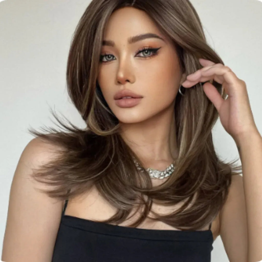 Mid-length platinum gradient synthetic wig with long curly hair and full bangs