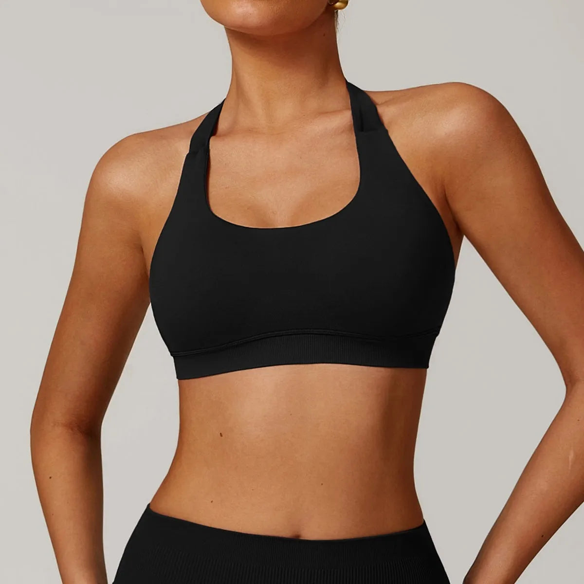 Women's halter style yoga sports bra in nylon with removable chest pads