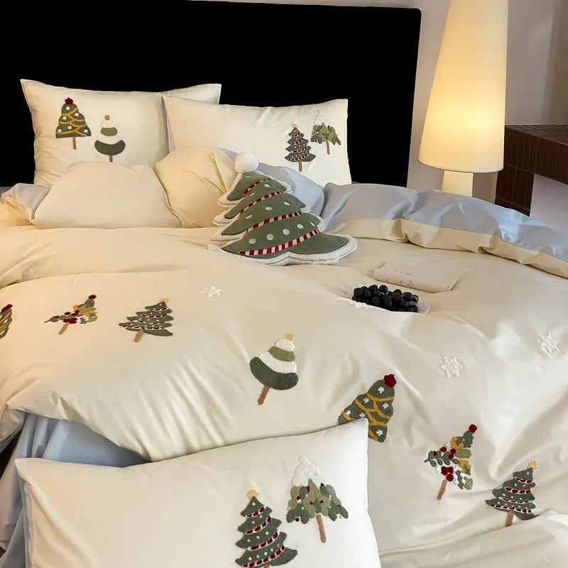 Pure cotton duvet cover set with embroidered Christmas trees and flowers, shown in cream blue colour.