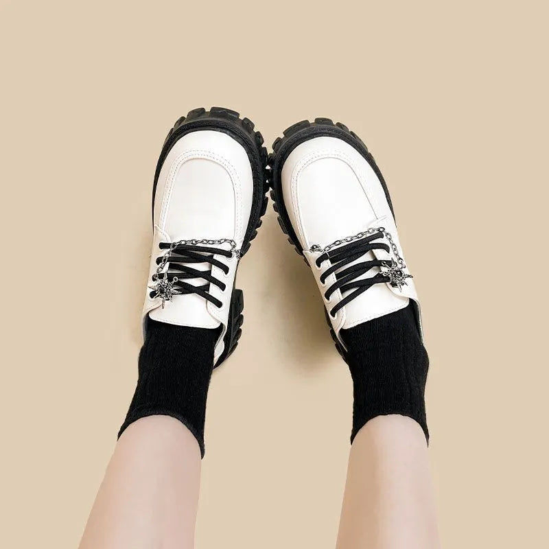 Women's preppy college loafers in Duke Asterism colour with cross shoulder straps and round toe design