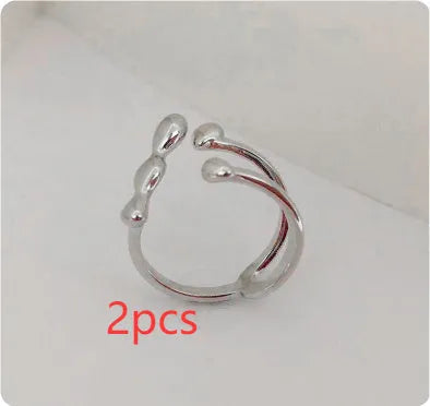 Women's brass opening ring with gold finish and circle sphere design
