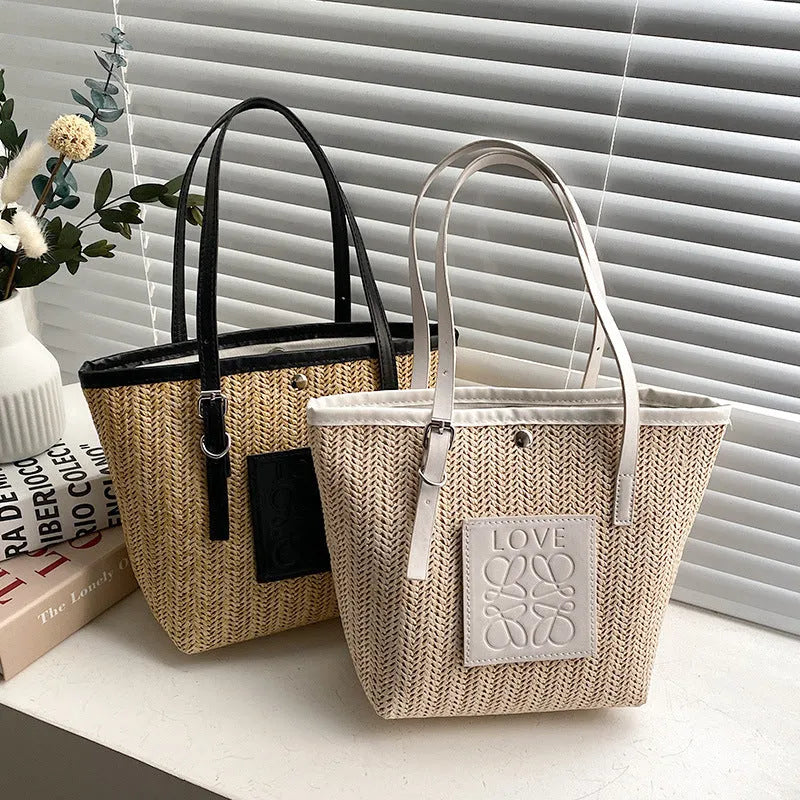 Straw woven women's shoulder bag in black with sewing thread detailing and large capacity design