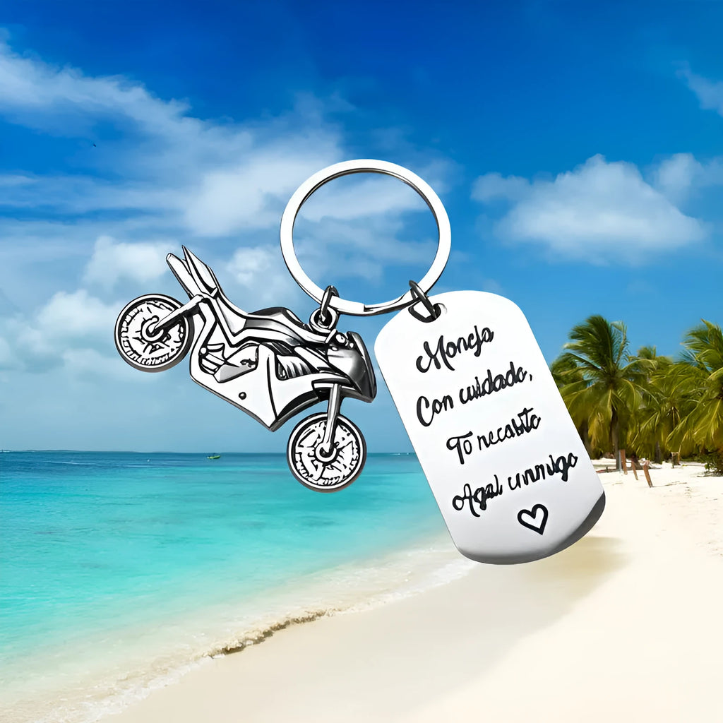 Stainless steel motorcycle keychain with a modern minimalist design, shown with a velvet flannel bag.