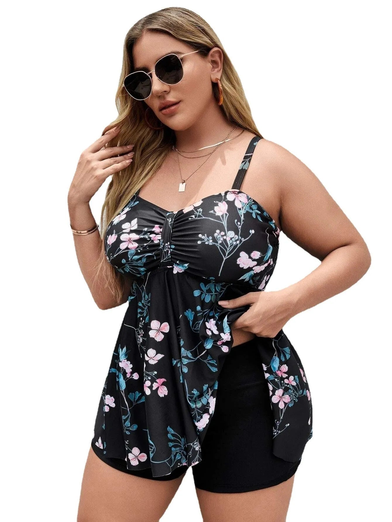 Women's one-piece swimsuit with a split colour floral print, shown in an extended size.