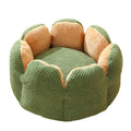 Green cactus petal shape plush pet bed for cats and dogs on hardwood floor