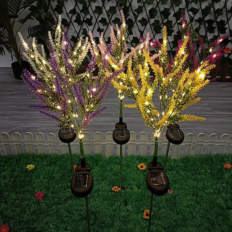A pink flower-shaped solar LED garden light standing 74 cm tall in an outdoor setting.