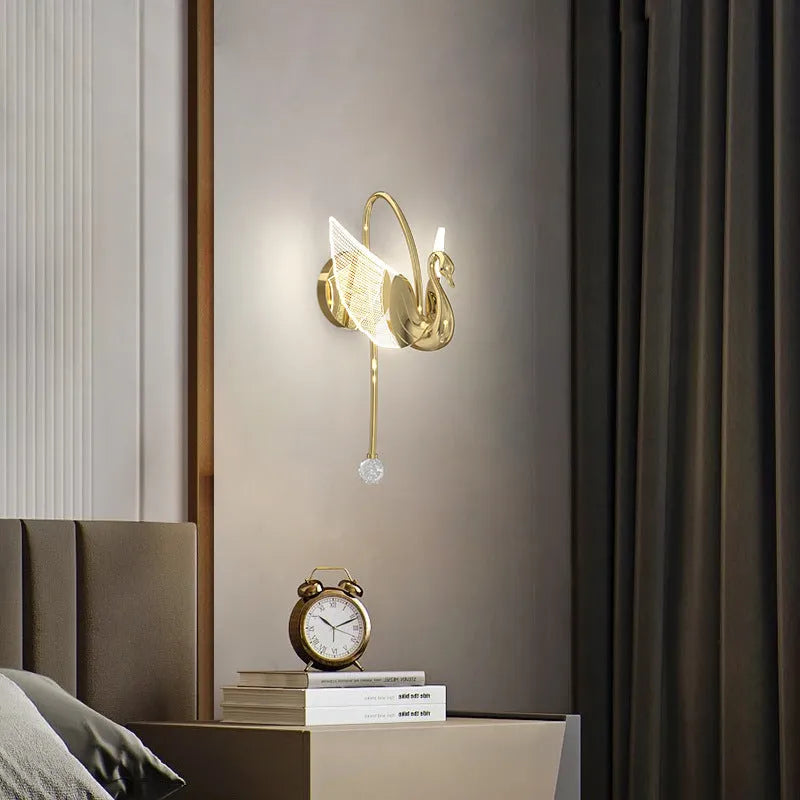 Gold swan design wall lamp with acrylic shade showing LED lighting and iron construction