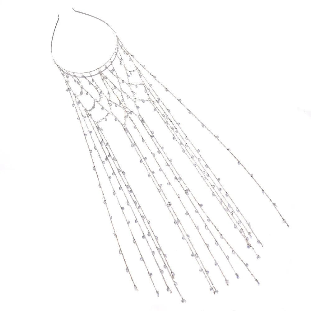 Gold and silver rhinestone mesh headband with a decorative tassel accessory.
