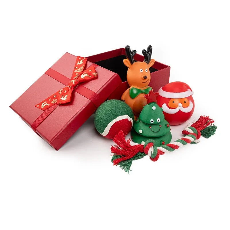 Christmas-themed vinyl dog chew toy set including barbells, balls, ropes, and festive figures in gift packaging.