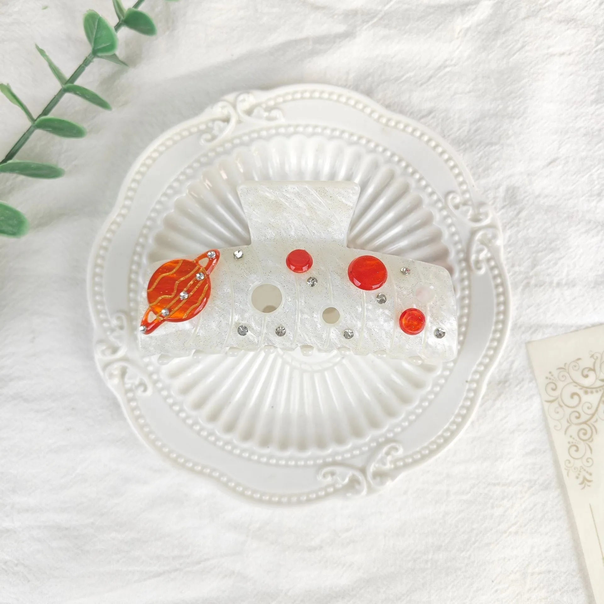 Oversized star moon barrette in celestial colours with irregular minimalist design