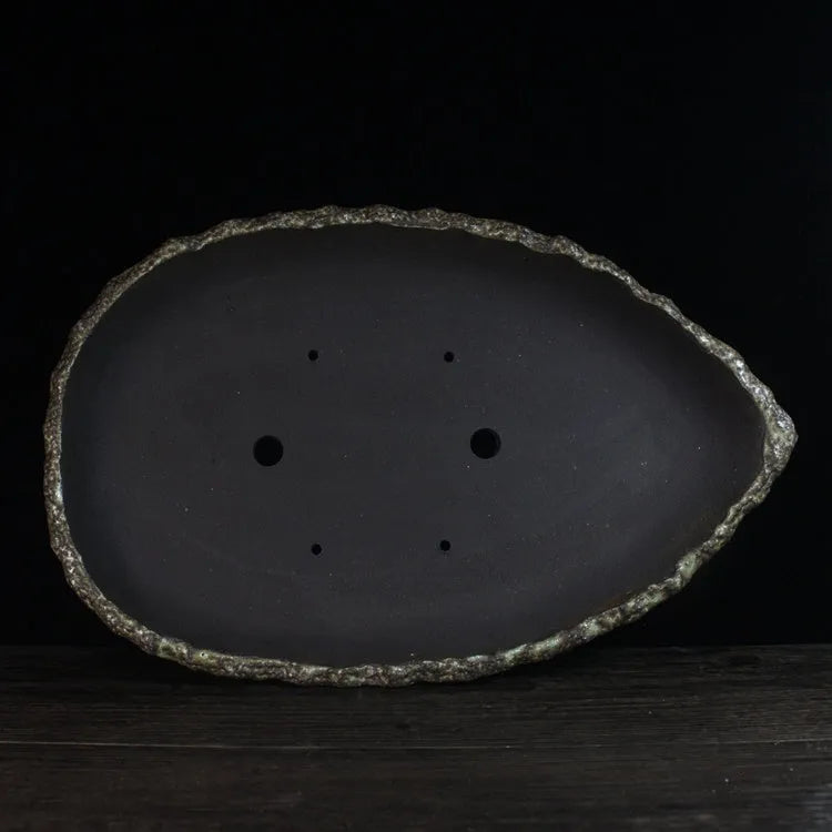 Handmade purple clay flower pot in floor-standing design with unique shape